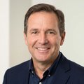 Portrait of James K., a business owner client, professional headshot, neutral background